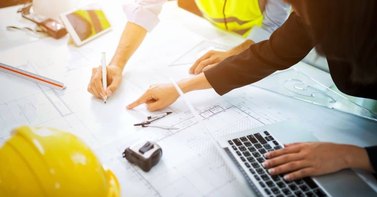 How does a schedule-driven EDMS help to complete construction projects on time and within budget?